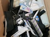 a cardboard box filled with electronic devices and other items