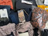 a pile of clothing and other items on a table