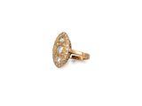 a close up of a gold ring with diamonds on a white background