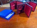 a small blue box with a red cover and a blue box with a blue lid