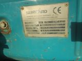 an image of a sign on the side of a blue machine