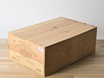 a wooden box that is sitting on a wooden floor