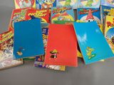 a lot of books that are sitting on a table