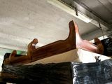several pieces of wood are stacked on top of each other in a warehouse