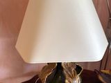 a lamp that is sitting on a table with a lamp on it