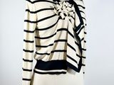 an image of a mannequin mannequin wearing a striped shirt and tie