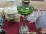 a table with a bunch of figurines and vases on it