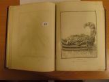 un livre ouvert sur lequel est dessiné un homme dans un bateau