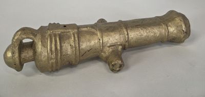 an old brass cannon on a white background
