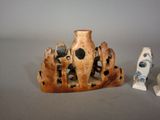 two vases sitting next to each other on a table