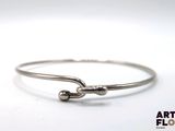 sterling silver bang bracelet with two balls on the end of it