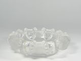 clear glass bracelet with cats on it on a white surface