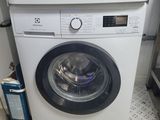 a washing machine and a dryer stacked on top of each other