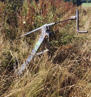 a machine that is sitting in the middle of a field
