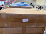 two boxes stacked on top of each other in a warehouse