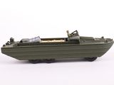 a toy boat with a man in it on a white surface