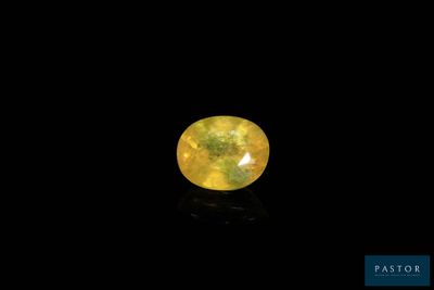 a yellow diamond on a black background