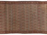 an antique rug with a brown and blue design