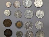 a lot of coins that are on the table