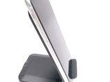 a cell phone that is sitting on top of a stand