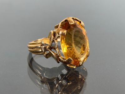 an image of a ring with a large citrine stone in it