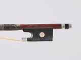 a bow that is attached to a string with a wooden handle