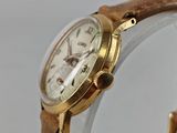 an image of a close up of a wrist watch on a white surface