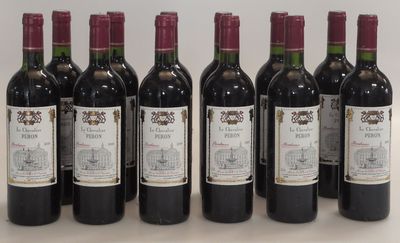 six bottles of wine are lined up on a table
