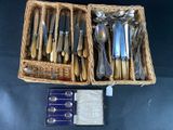 a lot of silverware in a basket on the table