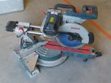 someone is using a circular saw to cut a piece of wood with a circular saw