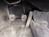 two pedals that are sitting on the floor of a car