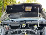 a car that has its hood open with the hood up