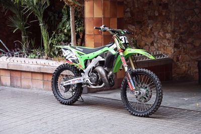 a dirt bike that is parked on the side of the street