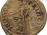 a gold coin with an image of a woman on it