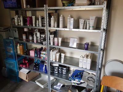 a shelf full of hair products in a room