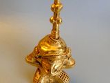 brass figurine of an elephant with a bell on its head