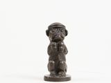 figurine of a monkey with a hat on its head