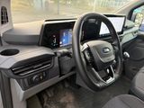 the interior of a car with a steering wheel and dashboard controls