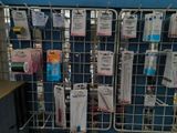 a metal rack with many items on it in a store