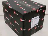a black box with a red stop sign on it sitting on top of a table