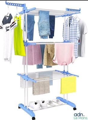 an image of a clothes rack with clothes hanging on it