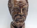 a statue of a man with a mustache and a moustache