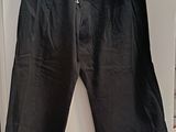 the pants are black and have zippers on them