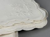 a lot of white napkins on top of each other