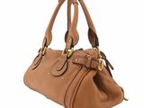 a brown leather handbag on a white background