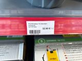 a close up of a cell phone on a shelf in a store