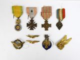 a lot of medals that are on a white surface