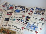 a lot of old french postcards on a table