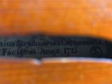 a close up of a guitar with a label on it