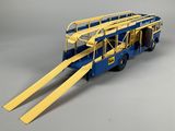 a blue and yellow fire truck with two ladders attached to it